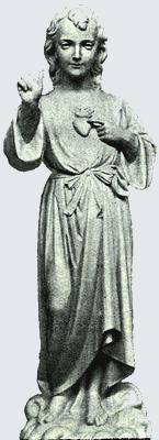La statue de l'Enfant Jésus au sommet du clocher